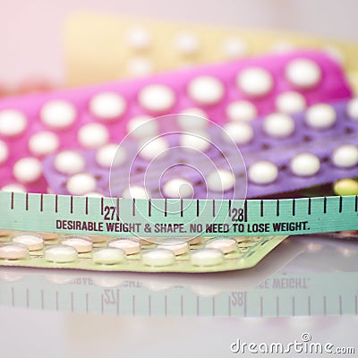 Contraceptive pill background in concept of no weight gain effect Stock Photo