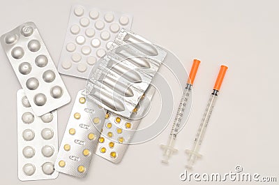 Contraceptive tablets in packages and without on a light background. Stock Photo