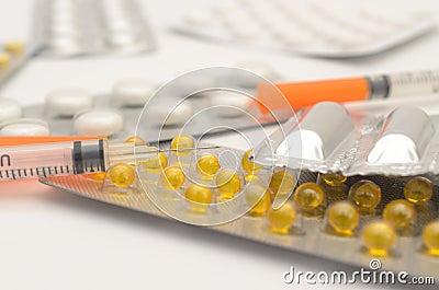 Contraceptive tablets in packages and without on a light background. Stock Photo