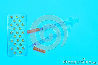 Contraceptive tablets in packages and without on a light background. Stock Photo