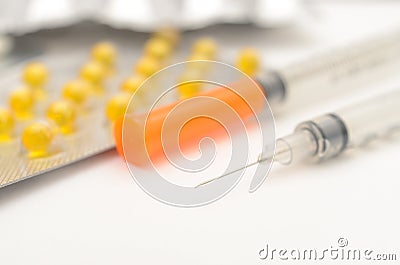 Contraceptive tablets in packages and without on a light background. Stock Photo