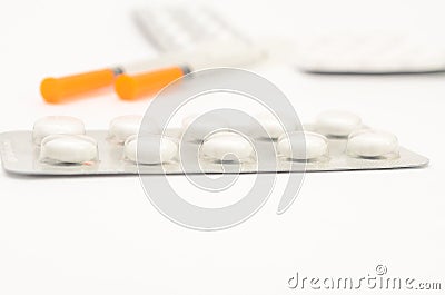 Contraceptive tablets in packages and without on a light background. Stock Photo