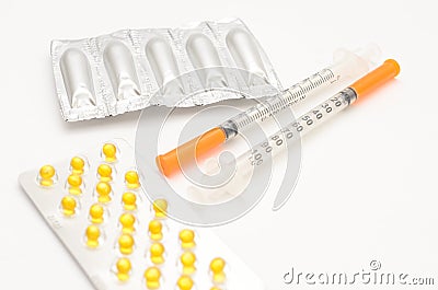 Contraceptive tablets in packages and without on a light background. Stock Photo