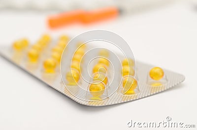 Contraceptive tablets in packages and without on a light background. Stock Photo