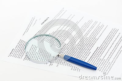 Contract with a magnifying glass Stock Photo