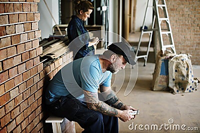 Contractor take a break after work Stock Photo