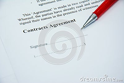 Contracts agreement sign on document paper with red pen Stock Photo