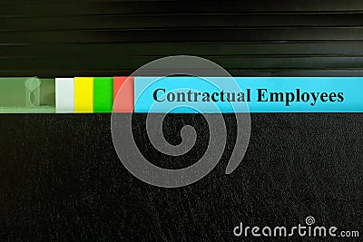 Contractual employees file record in black binder folder. Human resources concept. Stock Photo