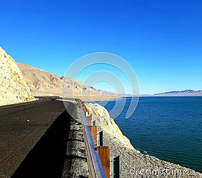 Contrast in Black and Blue - Highway iln Nevada Stock Photo