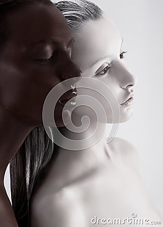 Contrast Bodyart. Ethnic Women Painted White and Black. Meditation Stock Photo