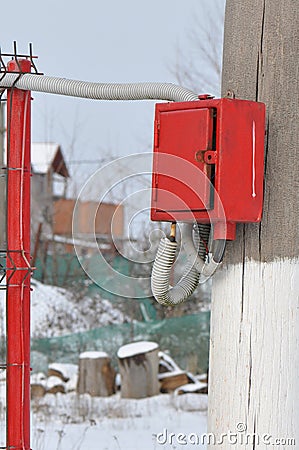 Control box on a wood pillar Stock Photo