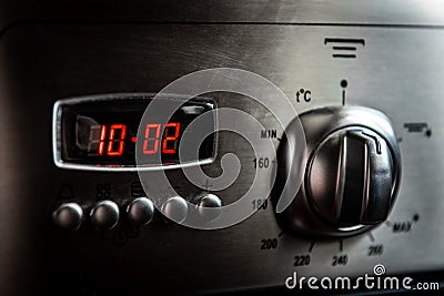 Control buttons and time display of modern kitchen electrical oven Stock Photo