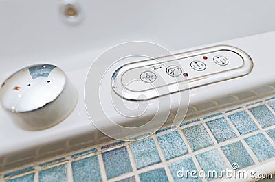 Control panel on bathtub with buttons Stock Photo