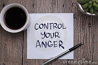 Control your anger, text words typography written on paper against wooden background, life and business motivational inspirational Stock Photo
