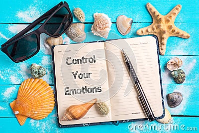 Control your emotions text in notebook with Few Marine Items Stock Photo