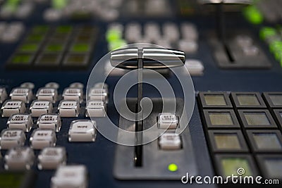 Broadcast television switcher in news studio with blur background. Stock Photo