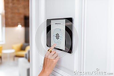 Controlling home ventilation with a digital touch screen panel Stock Photo