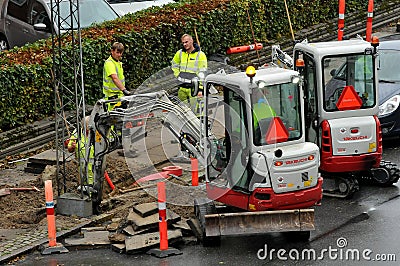 Construction worker working on underground wiring work Editorial Stock Photo