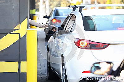 Convenient payment from car, drive thru system. Stock Photo