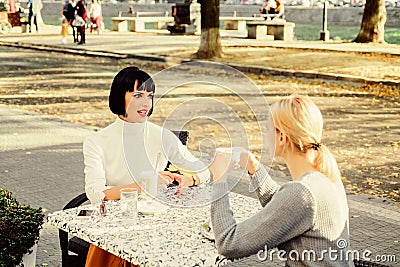 Conversation of two women cafe terrace. Friendship meeting. Sharing thoughts. Female friendship. True friendship Stock Photo