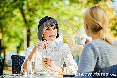 Conversation women cafe terrace. Friendship friendly relations. Discussing rumors. Trustful communication. Friendship Stock Photo