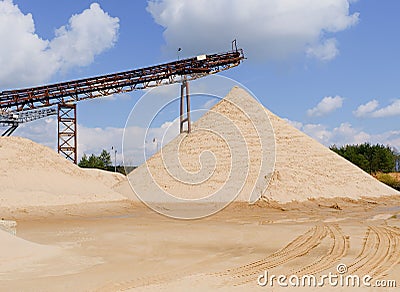 Conveyor belts and sand heaps. Construction industry. Sand quarry. Horizontal photo Stock Photo