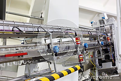 Conveyor with preforms for production of bottles Stock Photo