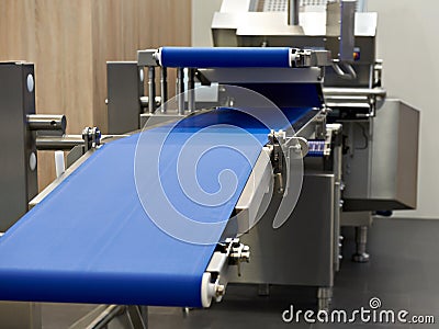 Conveyor and slicer for food industry Stock Photo