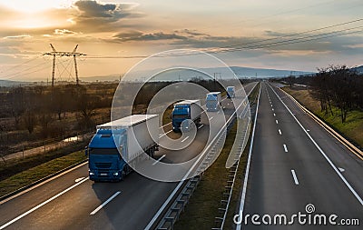 Convoy opf Blue Transportation trucks Stock Photo