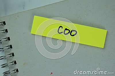 COO - Chief Operating Officer write on sticky notes isolated on Wooden Table Stock Photo