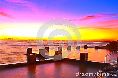 Coogee beach rock pool colourful sunrise. Stock Photo