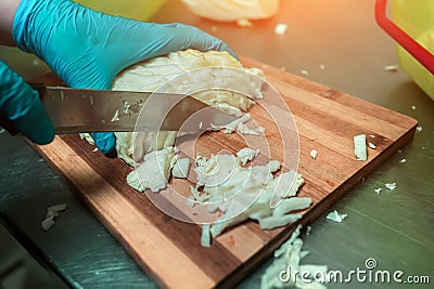 Cook cuts cabbage close-up Stock Photo