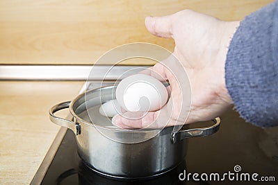 Cook the eggs on the kitchen stove. Cooking at home Stock Photo
