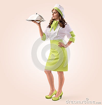 Cook girl with restaurant cloche or food tray Stock Photo