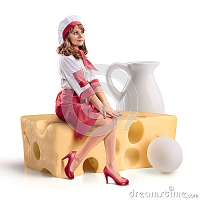 Cook girl sitting on a piece of cheese on isolated background Stock Photo