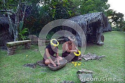 Cook Islander women works outdoor in a Maori village in the high Editorial Stock Photo