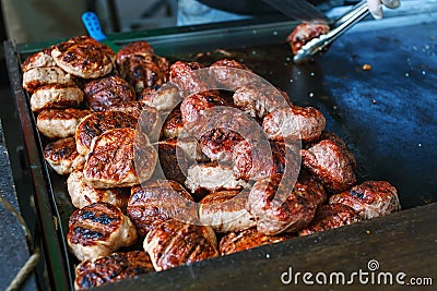 Cook making burgers outdoor on street food festival event Stock Photo