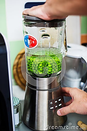 Cook preparing green puree Stock Photo