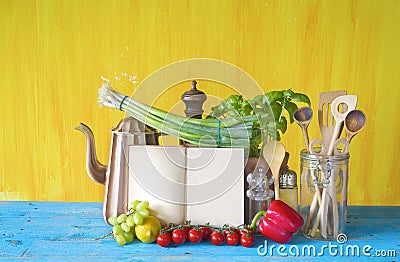 Cookbook, vegetables, kitchen utensils Stock Photo