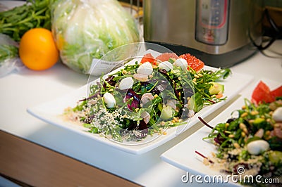 Cooked apetit dish beautifully decorated in a plate on a wooden table, natural light Stock Photo