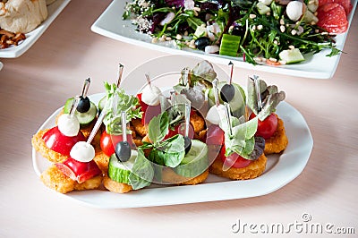 Cooked apetit dish beautifully decorated in a plate on a wooden table, natural light Stock Photo