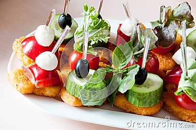 Cooked apetit dish beautifully decorated in a plate on a wooden table, natural lightÐ¼ Stock Photo