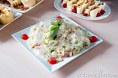 Cooked apetit dish beautifully decorated in a plate on a wooden table, natural light Stock Photo