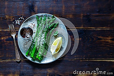 Cooked asparagus on plate Stock Photo