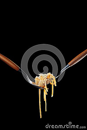 Cooked pasta twisted on fork with olive oil and parmesan Stock Photo