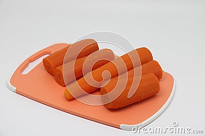 Cooked carrots plate isolated on white background Stock Photo