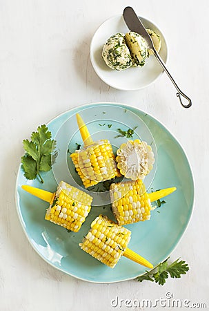 Cooked corn with herb butter Stock Photo