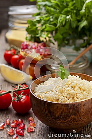 Cooked couscous, fresh vegetables for salad Stock Photo