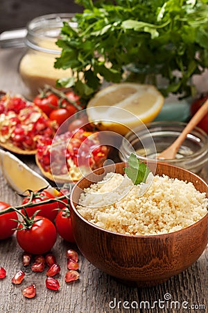 Cooked couscous, fresh vegetables for salad Stock Photo