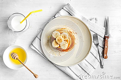 Cooked pancake on plate top view at wooden background Stock Photo